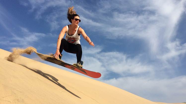 Catching air on the (sand) slopes near Mossel Bay. Source.